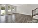 Spacious living area with hardwood floors, staircase and bright natural light at 769 River Park Rd, Belmont, NC 28012