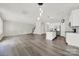 Open concept living area, with island kitchen, and gray tone vinyl floors at 769 River Park Rd, Belmont, NC 28012