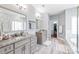 Spacious bathroom with dual vanities, granite countertops and walk-in closet at 8504 Soaring Eagle Ln, Waxhaw, NC 28173