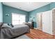 Comfortable bedroom with a warm, welcoming atmosphere, wood floors, and lots of light at 8504 Soaring Eagle Ln, Waxhaw, NC 28173