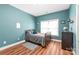 Charming bedroom with sleek wood floors and a bright, inviting atmosphere at 8504 Soaring Eagle Ln, Waxhaw, NC 28173