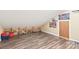 Bonus room showcasing laminate floors, built-in shelves, and natural light at 8504 Soaring Eagle Ln, Waxhaw, NC 28173