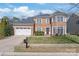 Charming brick home with well-manicured lawn, two-car garage, and neatly trimmed shrubbery at 8504 Soaring Eagle Ln, Waxhaw, NC 28173