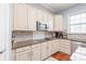 Well-lit kitchen features granite countertops, stainless steel appliances, and stylish tile backsplash at 8504 Soaring Eagle Ln, Waxhaw, NC 28173