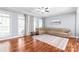Bright living room featuring hardwood floors, large windows, and comfortable sectional sofa at 8504 Soaring Eagle Ln, Waxhaw, NC 28173