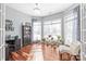 Bright office space with hardwood floors, large windows, and a cozy chaise lounge at 8504 Soaring Eagle Ln, Waxhaw, NC 28173