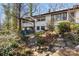 Backyard with a charming swing, lush landscaping, and a bird bath at 910 Forest Dr # 14, Lancaster, SC 29720