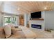 Finished basement featuring wood paneled walls, fireplace, and walkout to the patio at 910 Forest Dr # 14, Lancaster, SC 29720