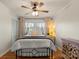 A comfortable bedroom features a cozy queen bed, bright windows, a closet and an end table at 910 Forest Dr # 14, Lancaster, SC 29720