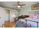 Bright bedroom featuring a ceiling fan, hardwood floors, a built-in bookshelf and a Bedroom at 910 Forest Dr # 14, Lancaster, SC 29720