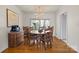 Charming dining room with a round wooden table, seating for six, and natural light from the large windows at 910 Forest Dr # 14, Lancaster, SC 29720