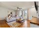 Open living room boasts hardwood floors, ample natural light, and stylish decor at 910 Forest Dr # 14, Lancaster, SC 29720