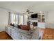 Spacious living room features built-in shelving and large windows at 910 Forest Dr # 14, Lancaster, SC 29720