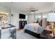 Serene main bedroom features a ceiling fan, hardwood floors, and black furniture at 910 Forest Dr # 14, Lancaster, SC 29720