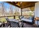 Relaxing covered porch offers seating, a swing, and views of the landscaped yard at 910 Forest Dr # 14, Lancaster, SC 29720