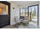 Cozy sunroom with white brick and comfortable seating to enjoy the outdoor view at 910 Forest Dr # 14, Lancaster, SC 29720