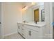 Bathroom with double sink vanity, quartz countertop, and modern black hardware at 1028 Grays Mill Rd, Charlotte, NC 28215