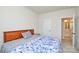Bedroom with a floral-patterned bedspread and an en-suite bathroom at 1028 Grays Mill Rd, Charlotte, NC 28215