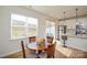 Cozy dining area featuring a wood table with four chairs next to the kitchen with stainless steel appliances at 1028 Grays Mill Rd, Charlotte, NC 28215