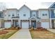 Charming townhome with a stone facade and attached garage at 1028 Grays Mill Rd, Charlotte, NC 28215