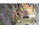 Aerial view of a property with a house, wooden gazebo, and an expansive lot at 105 4Th Se St, Catawba, NC 28609