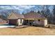 A cozy brick home featuring a garage, inviting walkway, and manicured landscaping at 105 4Th Se St, Catawba, NC 28609