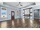 Bright living room with hardwood floors, tray ceiling, decorative wall, and recessed lighting at 105 4Th Se St, Catawba, NC 28609