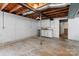 Unfinished basement featuring concrete floors, white walls, and a built-in kitchenette at 10633 Hwy 52 Hwy, Rockwell, NC 28138