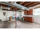 Unfinished basement with laundry area, offering potential for customization and additional living space at 10633 Hwy 52 Hwy, Rockwell, NC 28138