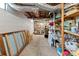 Unfinished basement with exposed ceiling, shelving, and ample storage space at 10633 Hwy 52 Hwy, Rockwell, NC 28138