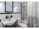Well-lit bathroom featuring tiled shower and tub combination with classic finishes and updated fixtures at 10633 Hwy 52 Hwy, Rockwell, NC 28138