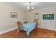 Traditional dining room with wood floors, chandelier lighting, and built-in storage at 10633 Hwy 52 Hwy, Rockwell, NC 28138