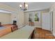 Bright dining room featuring hardwood floors, a chandelier, and lots of natural light at 10633 Hwy 52 Hwy, Rockwell, NC 28138