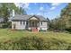 Quaint one-story home featuring a covered front porch, brick steps, and a neatly maintained lawn at 10633 Hwy 52 Hwy, Rockwell, NC 28138