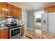 Charming kitchen featuring updated appliances, granite countertops, and bright natural light at 10633 Hwy 52 Hwy, Rockwell, NC 28138