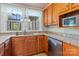 Kitchen featuring wood cabinets, granite counters, and stainless steel appliances at 10633 Hwy 52 Hwy, Rockwell, NC 28138