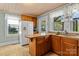 Bright kitchen featuring wood cabinets, granite counters, and stainless steel appliances at 10633 Hwy 52 Hwy, Rockwell, NC 28138