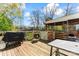 Wood deck with an outdoor cooking area and a covered space with comfortable seating at 11416 Leadenhall Ln # 22, Charlotte, NC 28262