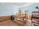 Bright bedroom with a weaving loom, a window with natural light, and neutral carpet flooring at 11416 Leadenhall Ln # 22, Charlotte, NC 28262