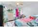 Bright and colorful bedroom with a ceiling fan, furniture, and natural light from the window at 11416 Leadenhall Ln # 22, Charlotte, NC 28262