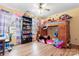 Bedroom featuring a playful loft bed, desk, and ample storage, creating a creative and functional space at 11416 Leadenhall Ln # 22, Charlotte, NC 28262