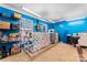 Bright bedroom with blue walls, carpet flooring, and windows that provide plenty of natural light at 11416 Leadenhall Ln # 22, Charlotte, NC 28262
