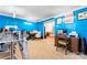 Spacious blue bedroom featuring carpet flooring, ample workspace, and natural light at 11416 Leadenhall Ln # 22, Charlotte, NC 28262