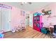 Playful pink bedroom featuring stylish furniture and organized storage for a vibrant atmosphere at 11416 Leadenhall Ln # 22, Charlotte, NC 28262