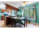 This kitchen features a dining area, beautiful natural light and wood cabinets at 11416 Leadenhall Ln # 22, Charlotte, NC 28262