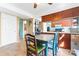 This kitchen features a dining area, and wood cabinets at 11416 Leadenhall Ln # 22, Charlotte, NC 28262