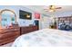Cozy main bedroom with wood floors, a TV, and a view to the ensuite bathroom at 11416 Leadenhall Ln # 22, Charlotte, NC 28262