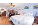 Bright and airy main bedroom with ceiling fan, wood floors and a view to another room at 11416 Leadenhall Ln # 22, Charlotte, NC 28262