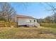 Spacious backyard with a new fence and a deck attached to the house at 1156 9Th St, Lancaster, SC 29720