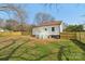 The house has a spacious, new fenced backyard and deck at 1156 9Th St, Lancaster, SC 29720